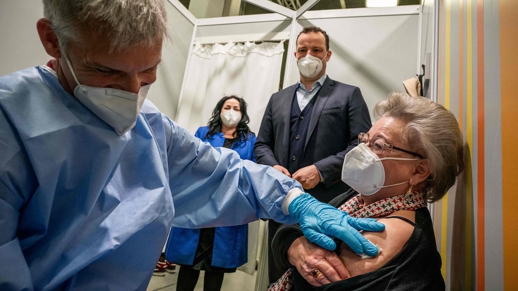 German health minister Jens Spahn (right) and Berlin’s health senator Dilek Kalayci (centre) watch 80-year-old vaccinee Rosemarie Langwald getting her second Covid-19 vaccine by vaccinist Tim Ratzloff in the vaccination centre at the fairgriunds in Berlin, on April 5th. Photograph: Michael Kappeler/Pool/AFP via Getty