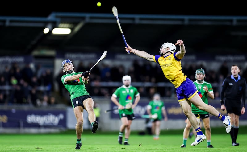 Paul Crummey scores a point for Lucan despite Na Fianna's Brian Ryan. Photograph: Nick Elliott/Inpho