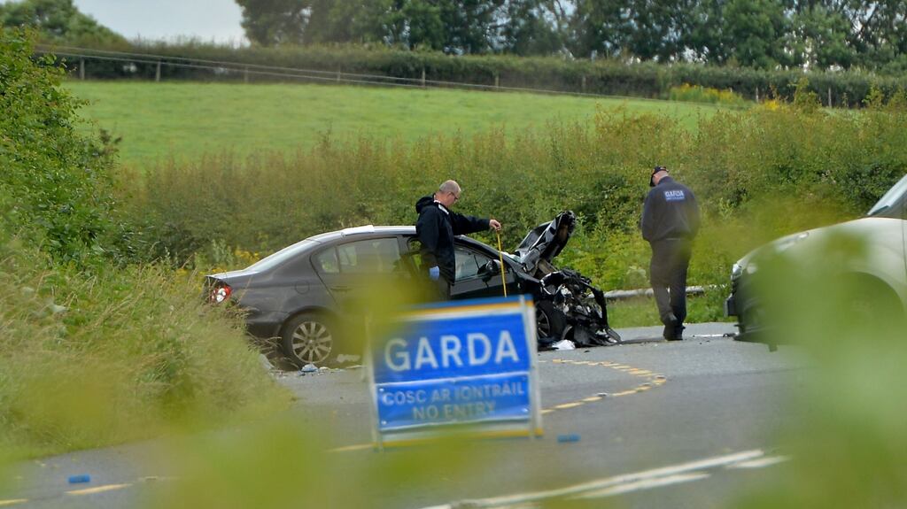 Gardai on the scene of a car crash in Co Louth that killed three people in July. Photograph: Alan Betson