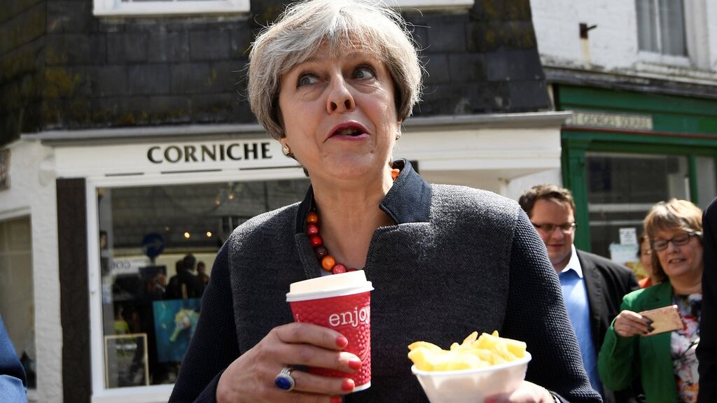 Then  prime minister Theresa May having some chips in one of Cornwall’s chi-chi towns during the Brexit campaign. Photograph: Dylan Martinez/PA