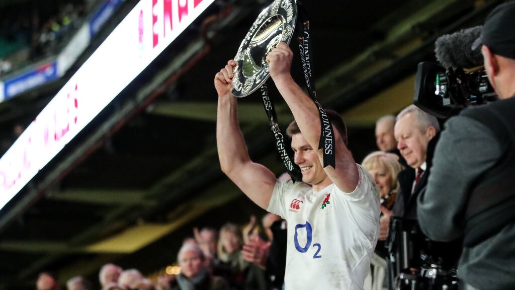 Owen Farrell celebrates England’s Triple Crown win after they beat Wales 33-30 at Twickenham. Photograph: James Crombie/Inpho