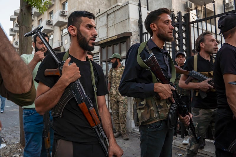 Security forces at the scene of the suicide bombing at St Elias church in Damascus, Syria. Photograph: Anagha Nair/Meadle East Images/AFP via Getty Images