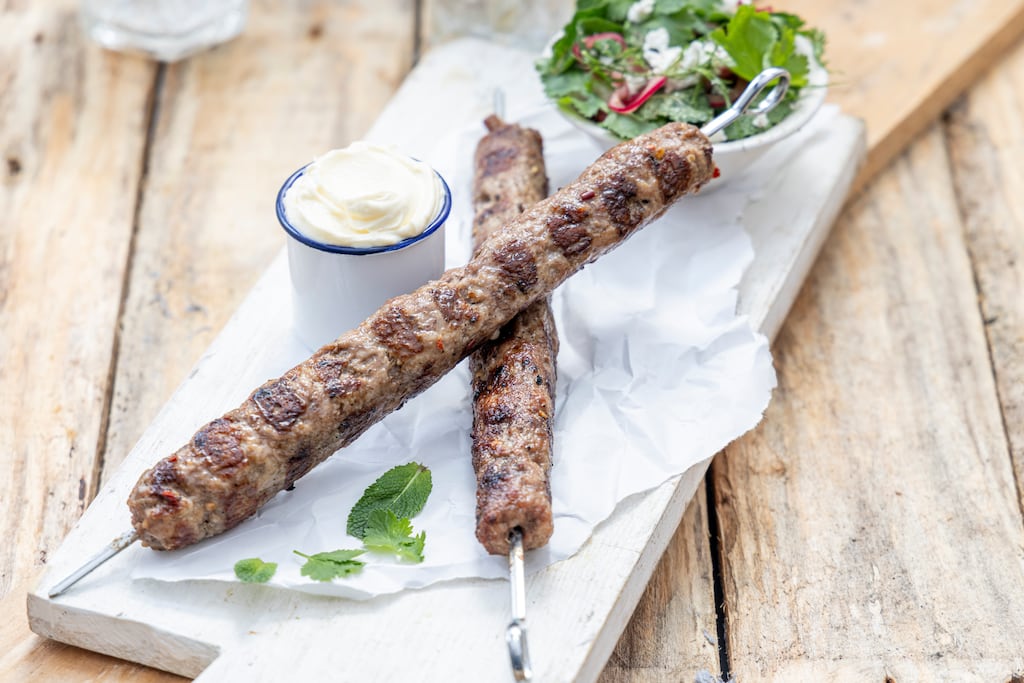 Barbecue lamb kofta with pickled red onion. Photograph: Harry Weir