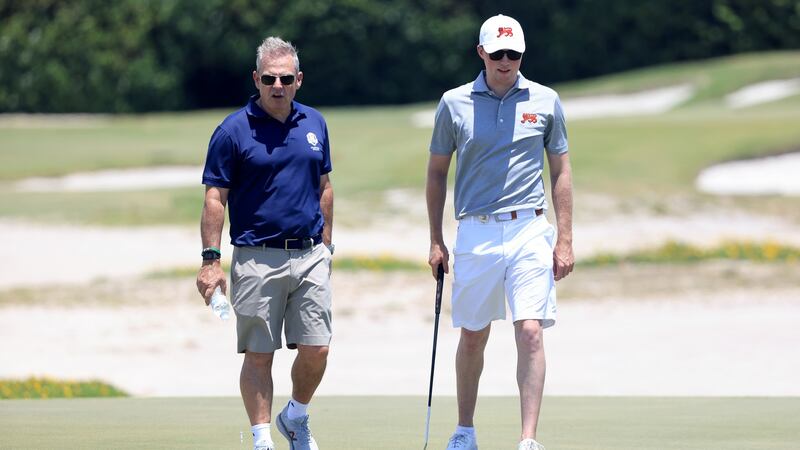Paul McGinley speaks with Mark Power during Wednesday’s practice round. Photo: Sam Greenwood/R&A/R&A via Getty Images