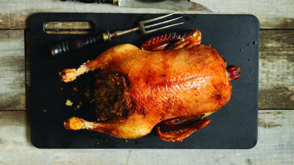 Roast fat duck with foie gras stuffing and lacquered duck heart skewers. Photograph: Deirdre Rooney