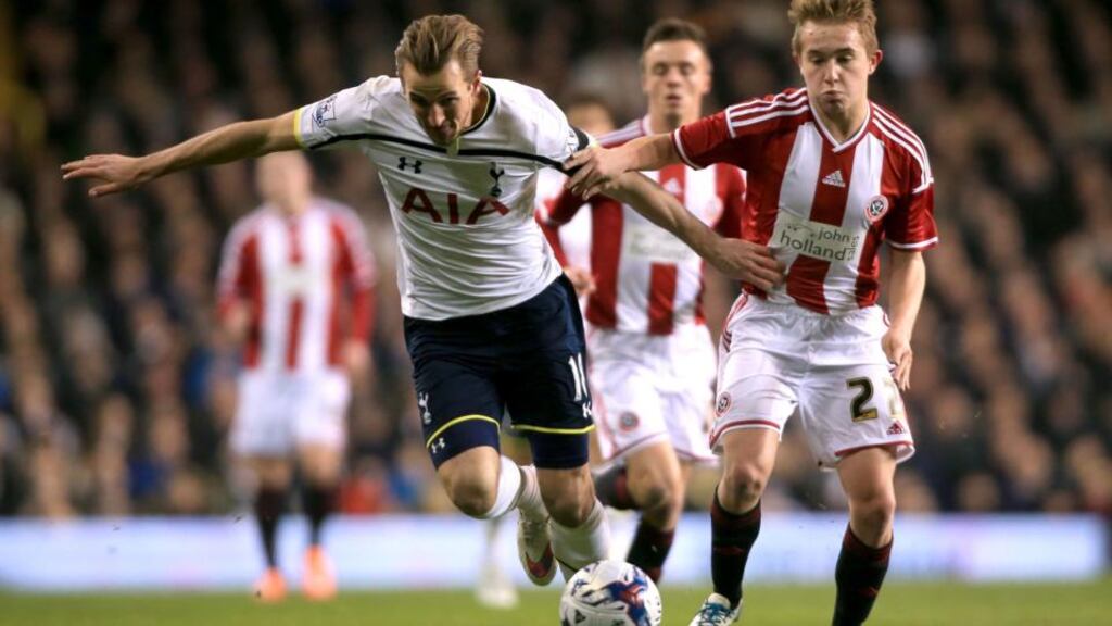 Tottenham Hotspur’s Harry Kane and Sheffield United’s Louis Reed battle for the ball during the Capital One Cup Semi Final, First Leg at White Hart Lane. Photograph: Nick Potts/PA