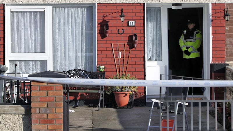 A garda at a house on Greenfort Drive, Clondalkin where the body of Cathy Ward was found. Photograph: Collins.
