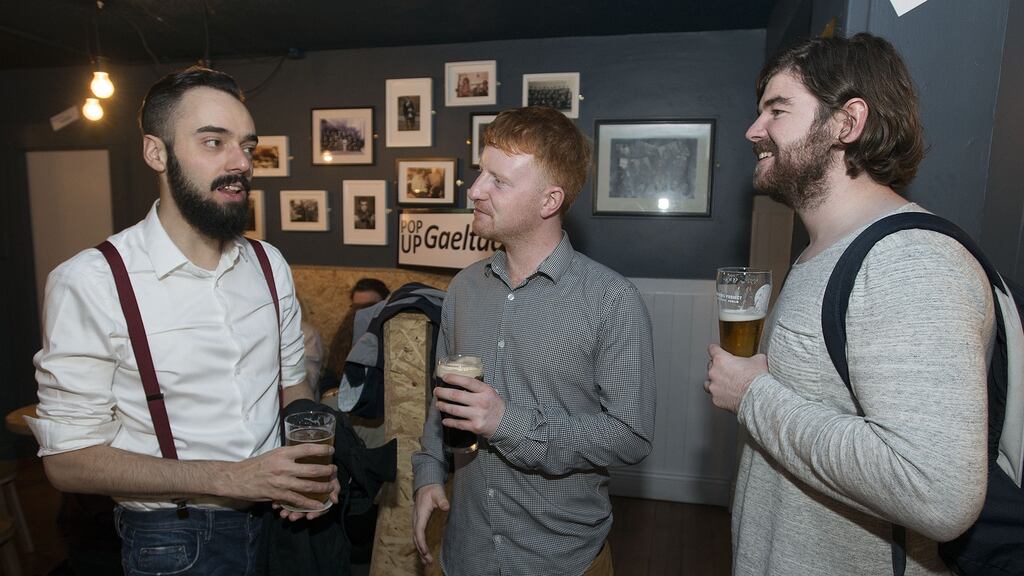 Emmanuel Bourgerie from France; Matthew Ó Cribin and Dylan Armstrong from Ashbourne, at a Pop-Up Gaeltacht event in the Piper’s Corner in Dublin. Photograph: Dave Meehan