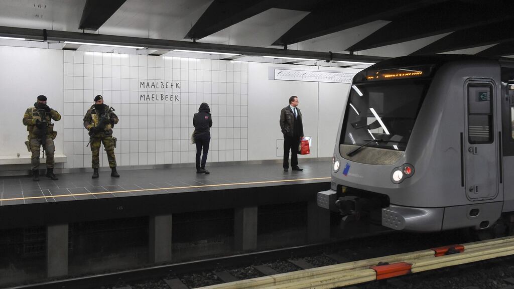 Belgian servicemen stand guard as a train arrives at the Maalbeek metro station on its re-opening day on April 25th, 2016 in Brussels, after being closed since the 22nd March attacks in the Belgian capital. Photograph: JohnThysjohn/ AFP/Getty Images