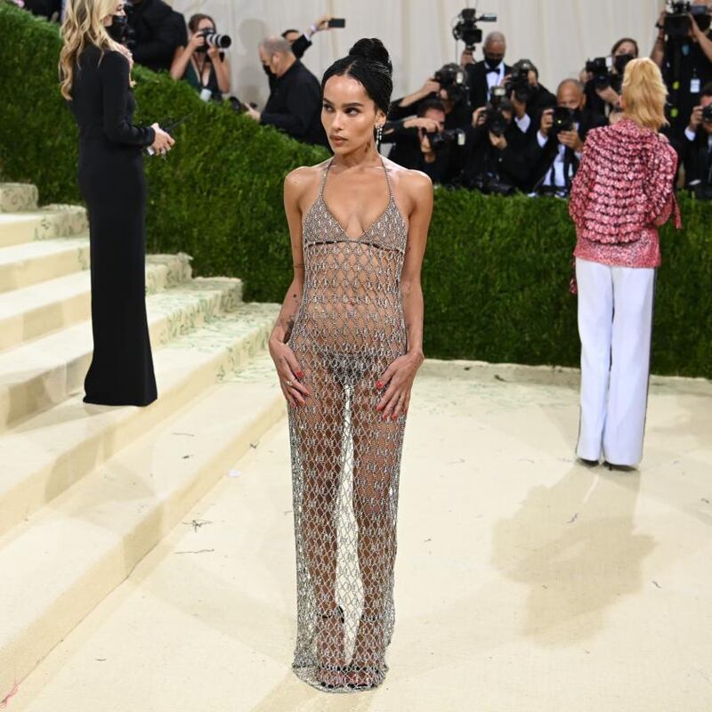 Zoe Kravitz walked the beige carpet in a rhinestone, fishnet dress with a matching set of underwear peeking through