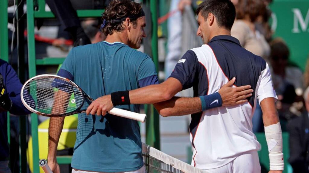 Novak Djokovic congratulates Roger Federer after their semi-final match at the Monte Carlo Masters in Monaco. Photograph: Patrice Masante/Reuters