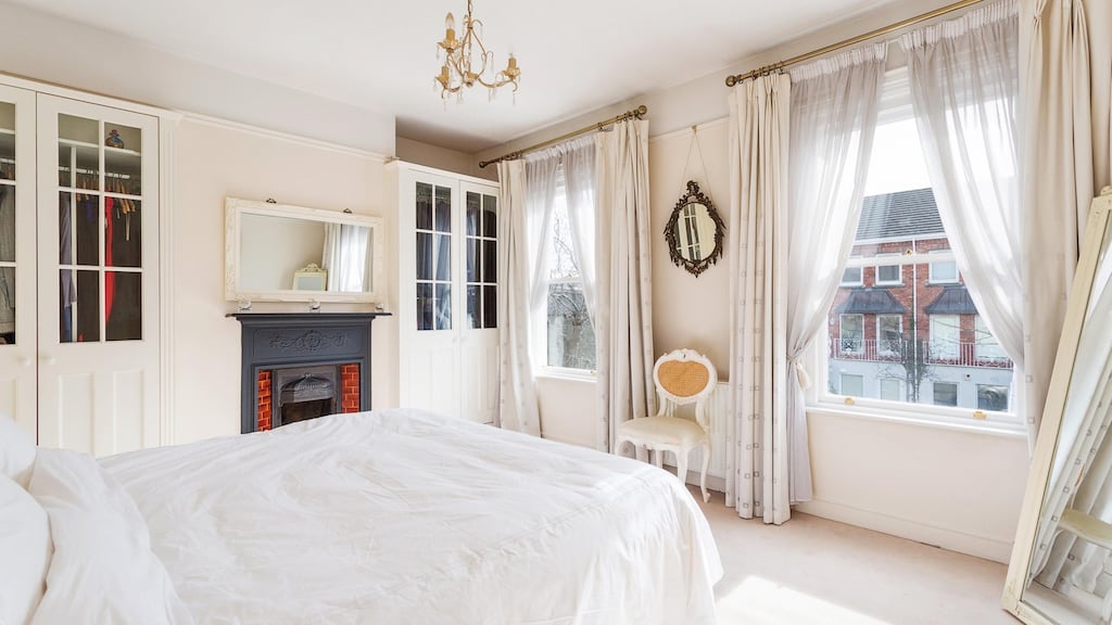 A comfortable home in creamy colours: one of the bedrooms at 2 Northbrook Villas