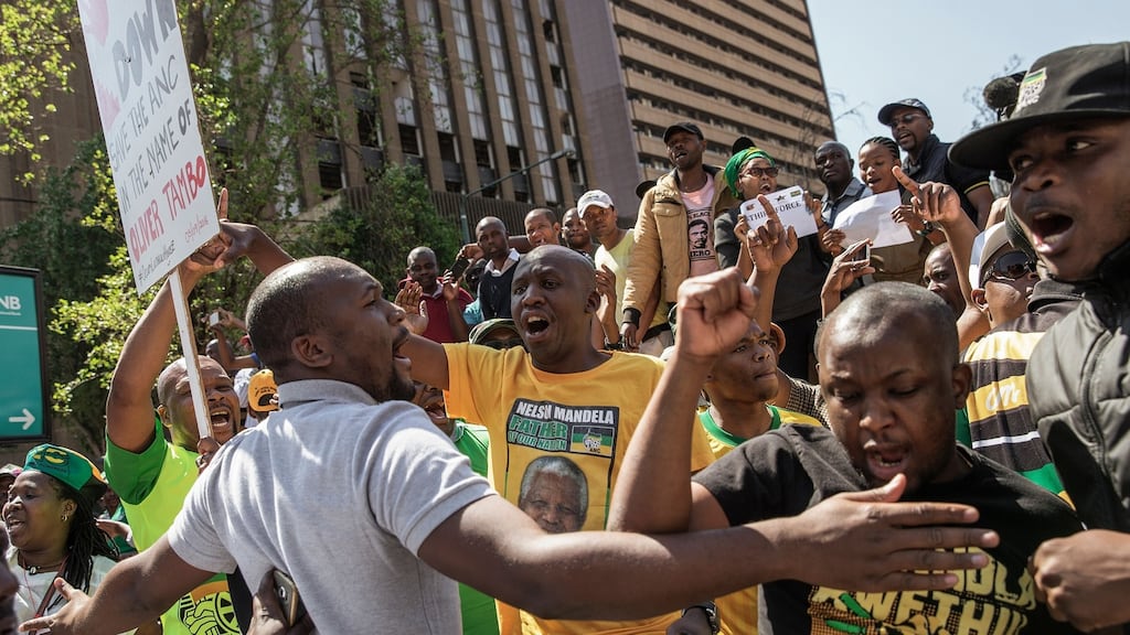 Disgruntled members of South Africa’s ruling African National Congress party demonstrate near party headquarters, demanding the resignation of President Jacob Zuma and the national executive committee, on Monday. Photograph: Gianluigi Guercia/AFP/Getty Images