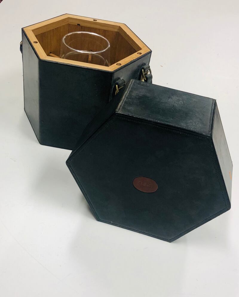 Lot 630: Charlie Haughey’s inscribed leather portable wine case, €150 - €200