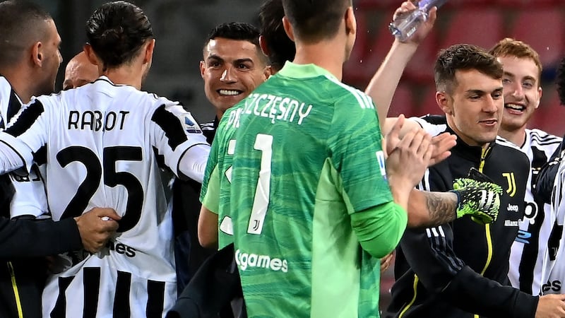 Juventus celebrate after they scraped into fourth place in Serie A with victory over Bologna. Photograph: Andreas Solardo/Getty/AFP