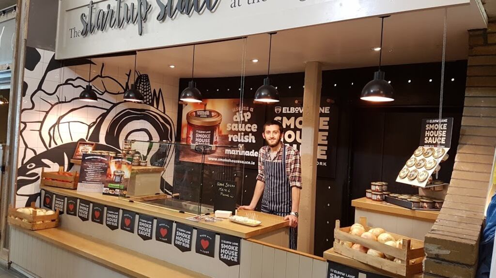 Ciaran Cummings, manager of Elbow Lane Brewery and Smokehouse, at the Start-Up Stall at Cork’s English Market, where the makers of Smokehouse Sauce are running a 24days24ways initiative during their guest trader residency