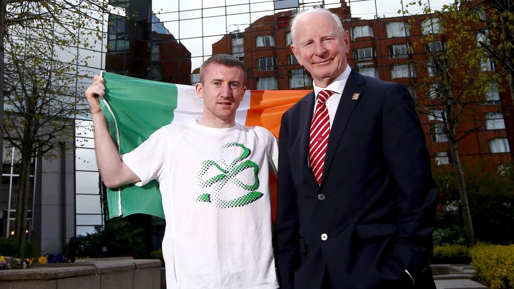 Boxer Paddy Barnes, flag bearer for the Ireland team at the 2016 Olympic Games in Rio, with Olympic Council of Ireland president Pat Hickey. Photograph: James Crombie/Inpho.