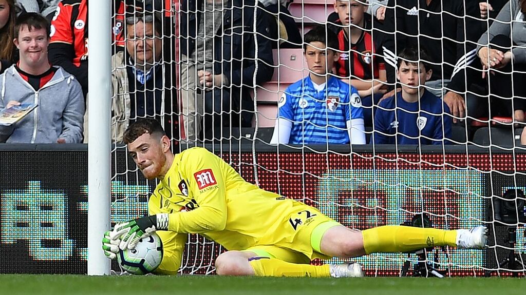 Bournemouth’s Mark Travers makes a save during their Premier League clash with Tottenham Hotspur.