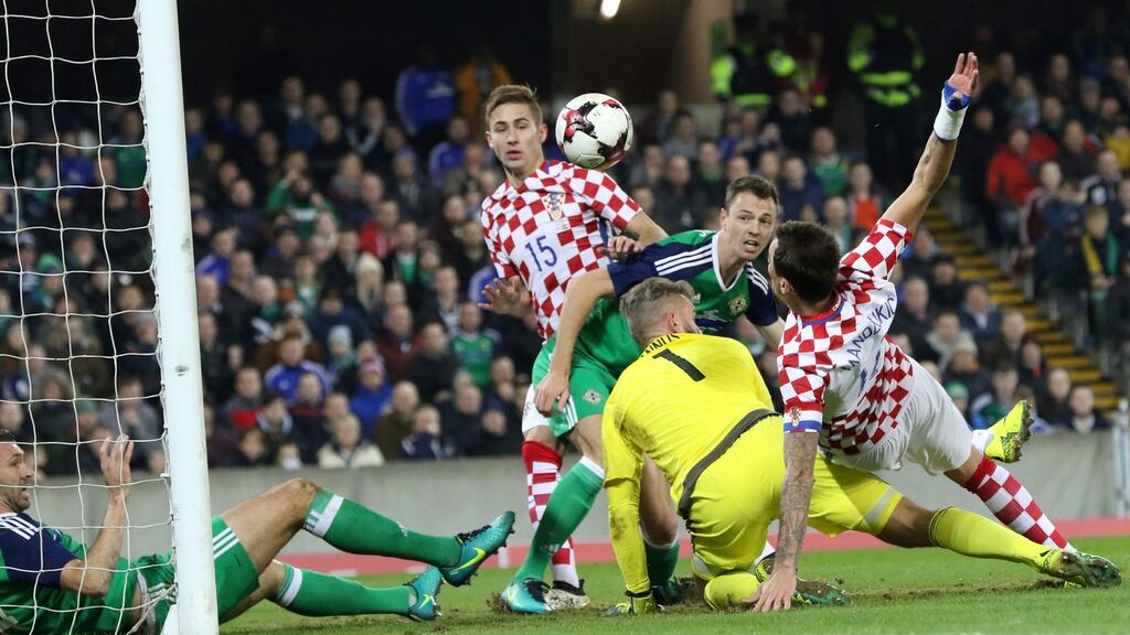 Croatia’s Mario Mandzukic scores his team’s first goal past Northern Ireland’s Alan Mannus during their friendly international at Windsor Park, Belfast. Photo: getty Images