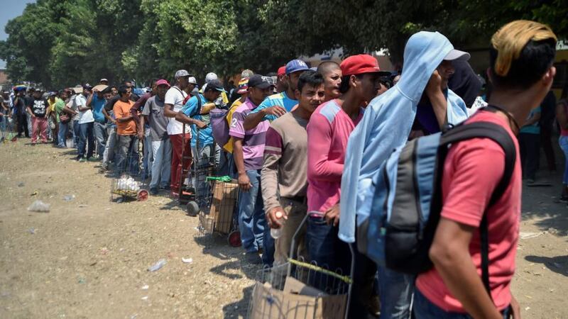 Venezuelan migrants wait for food outside La Divina Pastora shelter in Villa del Rosario, Colombia, on February 13th, 2019. Photograph: Luis Robayo