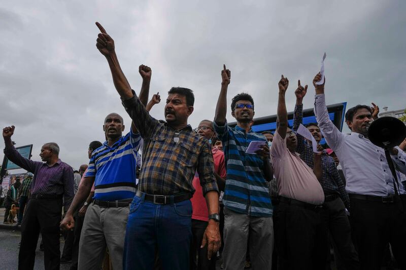 Protesters shout anti-government slogans outside the president’s office in Colombo, Sri Lanka. Photograph: Eranga Jayawardena/AP