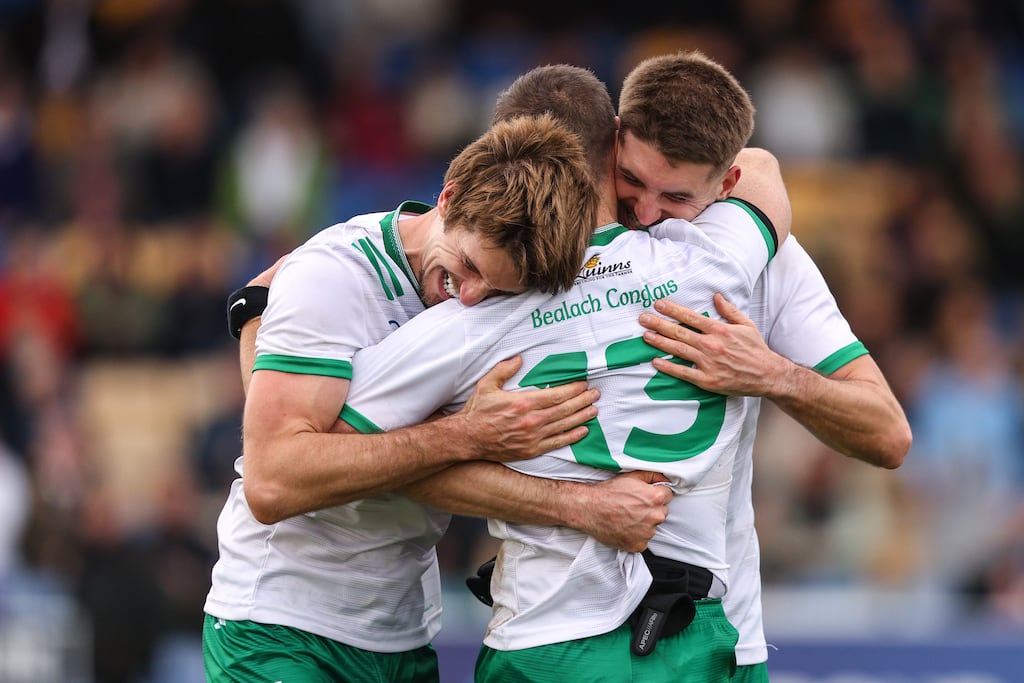 Baltinglass' Pat Burke and his brother Tom Burke celebrate after the final whistle with John McGrath. Photograph: Ben Brady/Inpho