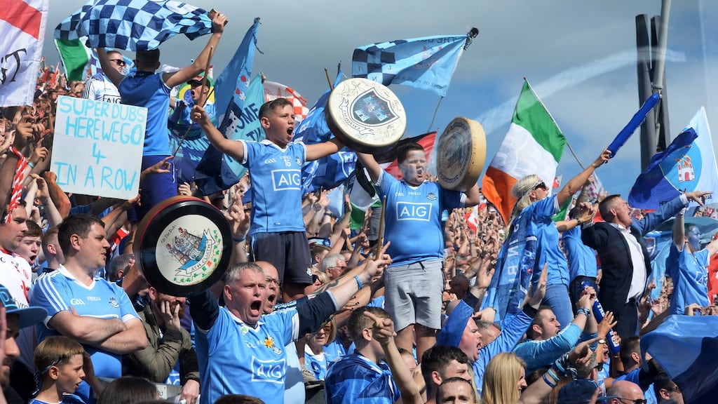 Dublin fans celebrate as their team defeat Tyrone at Croke Park to make it four All-Irelands in a row. Photograph: Dara Mac Dónaill