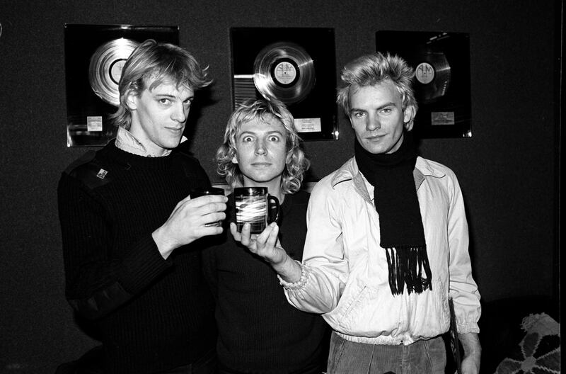 The Police - Stewart Copeland, Andy Summers and Sting - celebrate signing their record deal at the A&M offices in New York in March 1978. Photograph: Richard E Aaron/Redferns