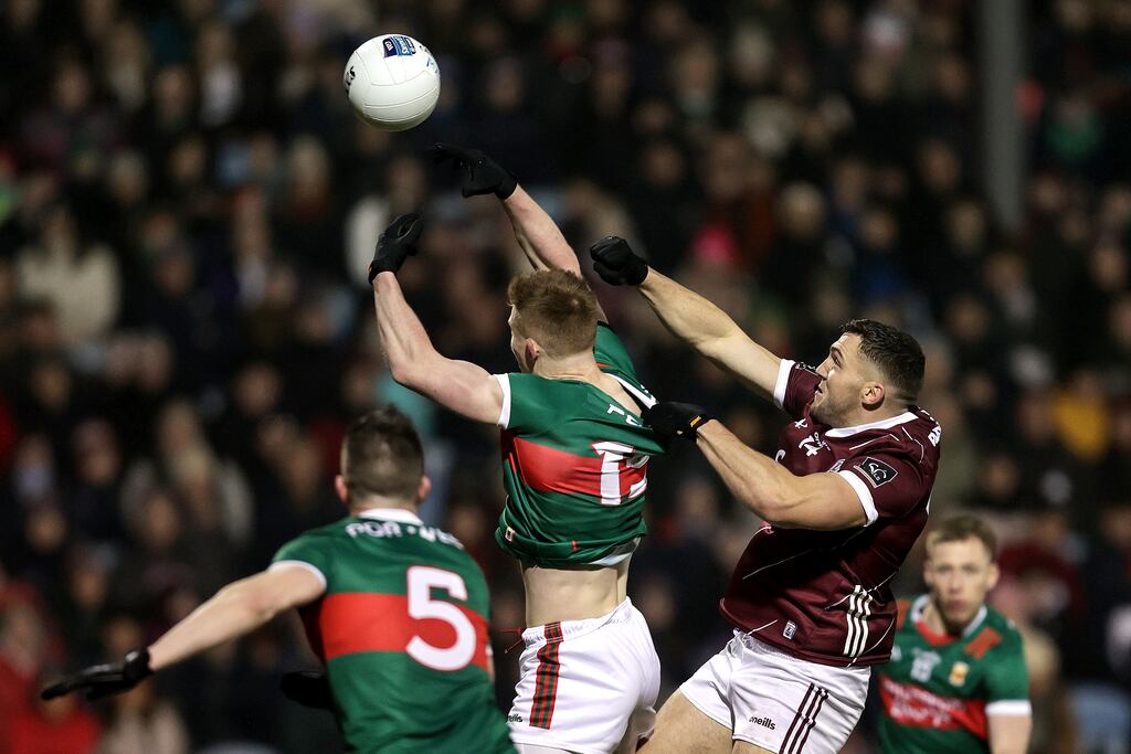 Mayo's David McBrien and Damien Comer of Galway in action during their NFL encounter in McHale Park in January. Photograph: Laszlo Geczo/Inpho