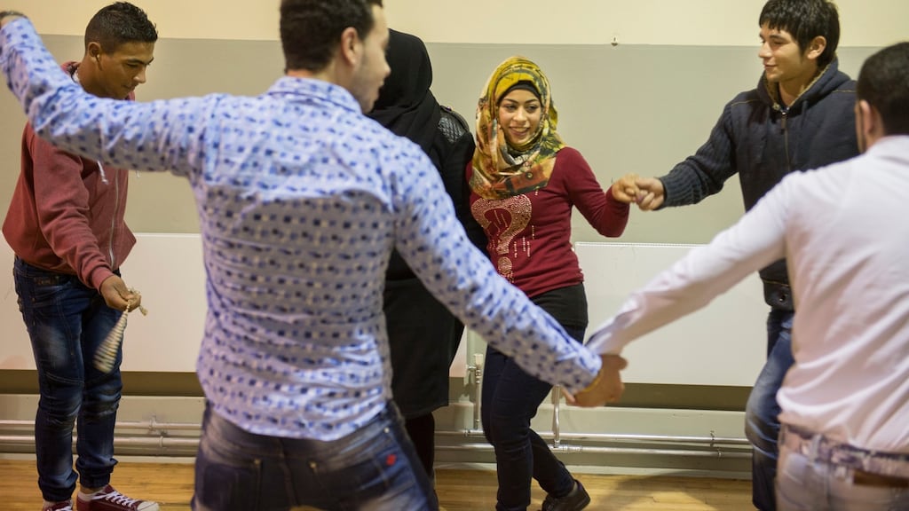 Syrian refugees perform an Arabic dance at an intercultural evening in Monasterevin, Co Kildare. Photograph: Dara Mac Dónaill/The Irish Times