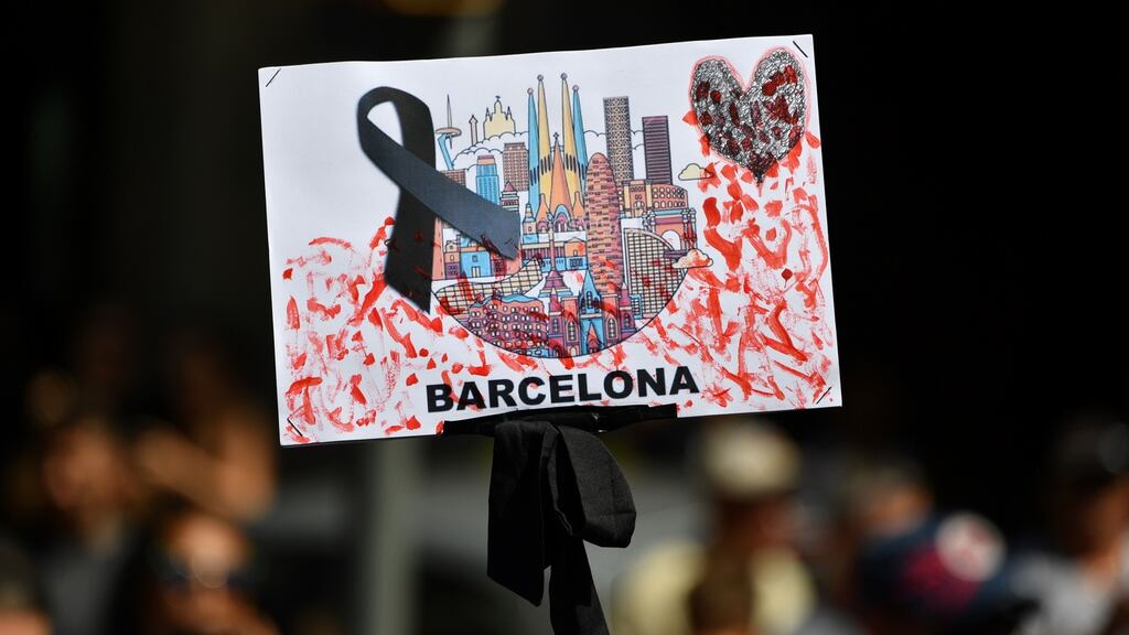 A placard with a black ribbon is brandished on Las Ramblas in Barcelona, Spain, following the recent terror attack on the street. Photograph: Pascal Guyot/AFP/Getty