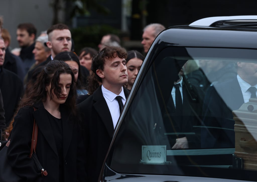 Cian O'Connor with his fiancée Shauna following the hearse on Tuesday at the joint funerals of Mark O'Connor, Louise Doherty O'Connor and their son Evan O'Connor. Photograph: Colin Keegan/Collins Dublin