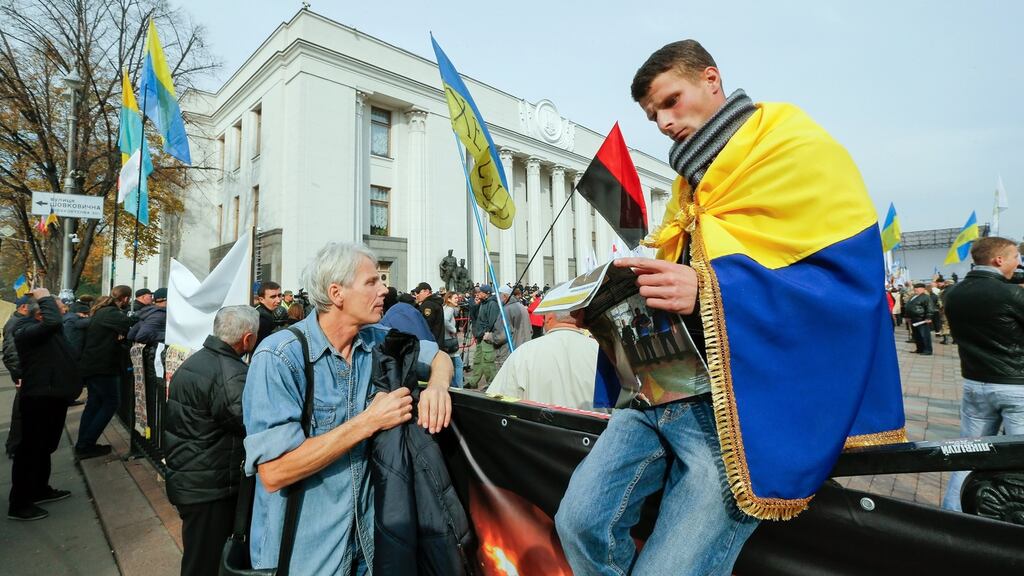 Protesters attend a rally near the Ukrainian Parliament building in Kiev, Ukraine, on Thursday. Photograph: Sergey Dolzhenko/EPA