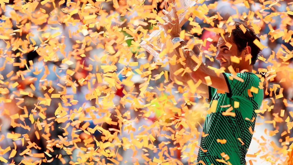 Roger Federer holds the trophy after defeating Rafael Nadal in the Miami Open final. Photograph: Getty Images
