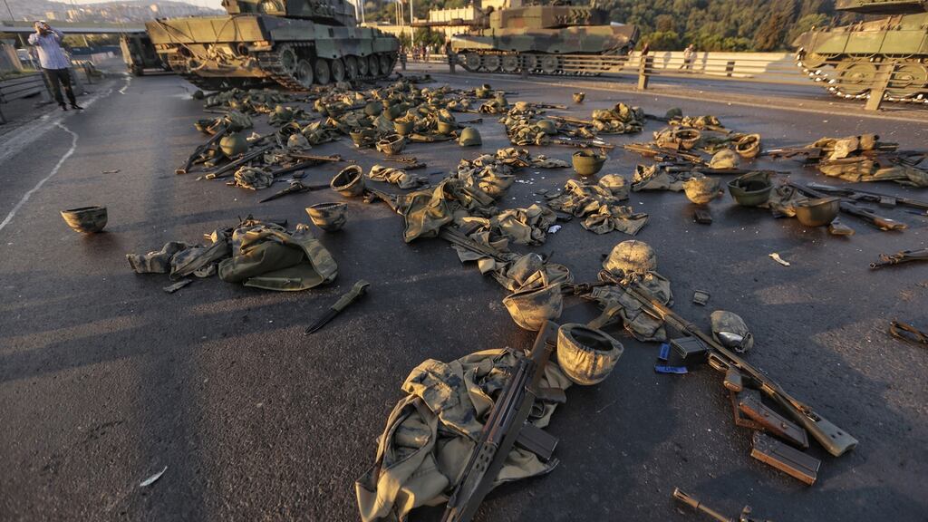 Clothes and weapons belonging to soldiers involved in the coup attempt who surrendered lie abandoned on the Bosphorus bridge on Saturday in Istanbul. Photograph: Gokhan Tan/Getty Images