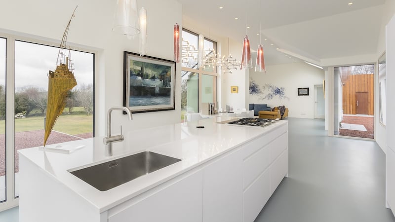 The kitchen, by McNally in Ballsbridge, has Gaggenau appliances including a wine cooler and retractable extractor fan