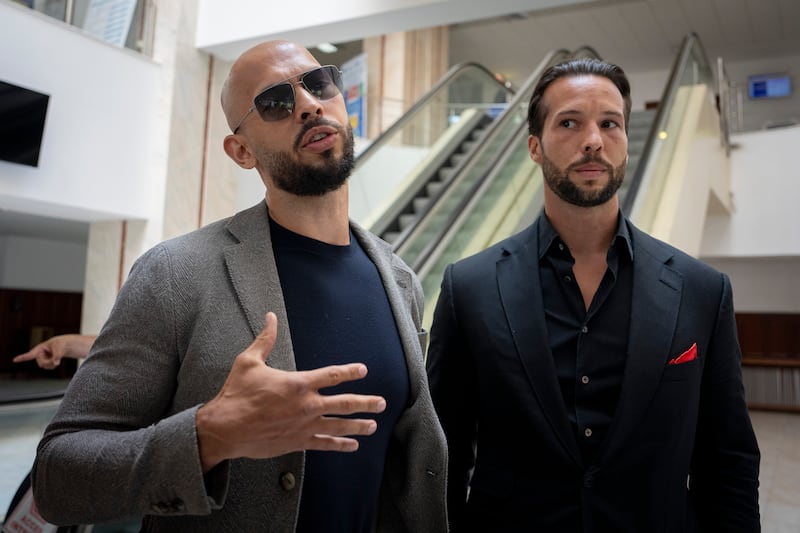 Andrew Tate (left) and his brother Tristan Tate. Photograph: Andreea Alexandru/AP