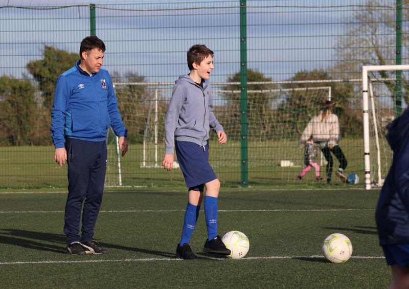 Football For All: Coach Phil Pierce and his son William, who is part of the team at East Meath United. Photograph: Dara Mac Dónaill