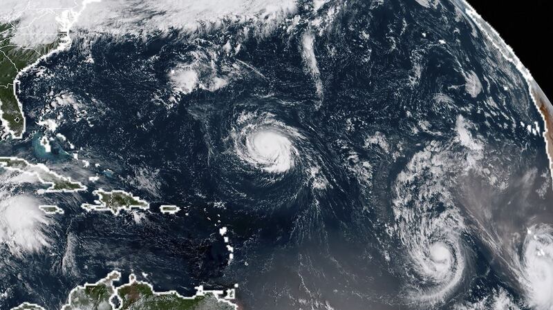 This NOAA/RAMMB satellite image taken on Sunday shows (L-R) Tropical Storm Florence, Tropical Storm Isaac and Tropical Storm Helene in the Atantic Ocean. Photograph: Getty Images