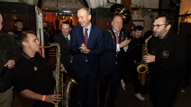 An Taoiseach Micheál Martin and Lord Mayor of Cork Cllr Colm Kelleher with the Hyde Park Brass Band at the Guinness Cork Jazz Festival opening night in the Metropole Hotel, Cork, on Friday. Photograph: Darragh Kane