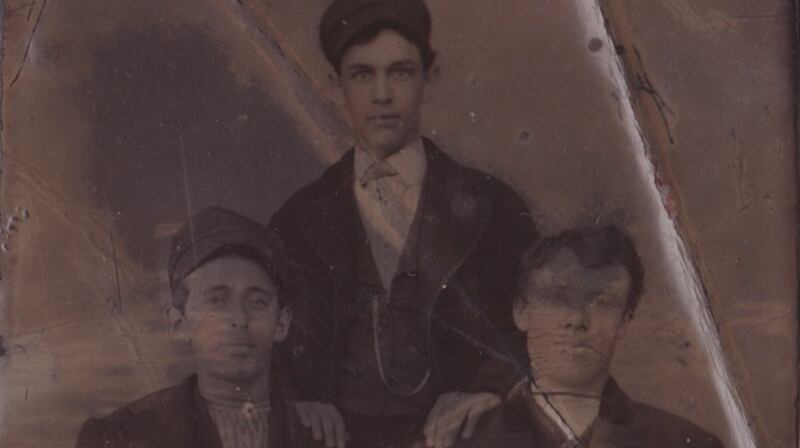Florence Burke (centre) with his brother John (left), and possibly his cousin Michael at Immigration in New York City.