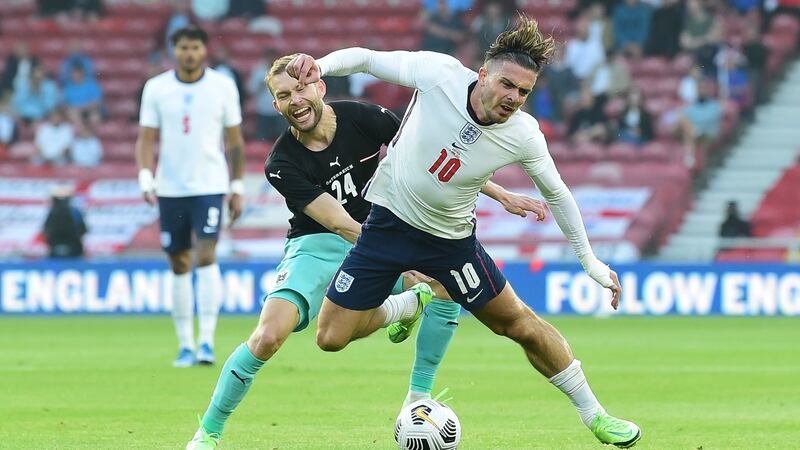 Jaclk Grealish is fouled during England’s friendly win over Austria. Photograph: Peter Powell/EPA