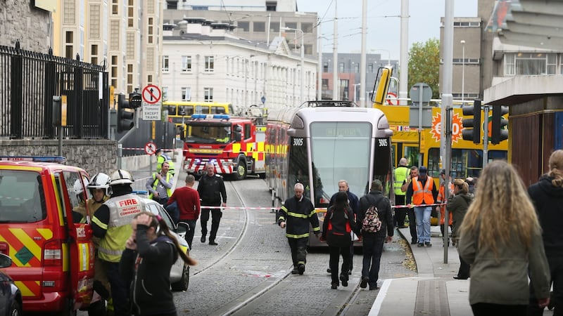 A general view of the scene after a crash involving  a Luas tram and a tour bus in Smithfield, Dublin on Friday. Photograph: Collins.