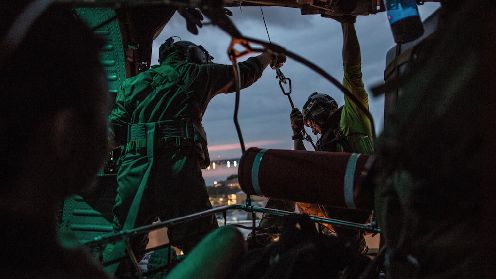 Rescue mission: US airmen search for trapped residents of the Texas city of Beaumont. Photograph: Christopher Lee/New York Times