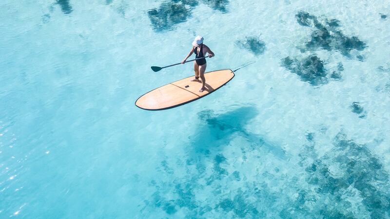 The yacht comes with a watersports hub stocked with paddleboards, water skis, sea kayaks, wakeboards and scuba gear