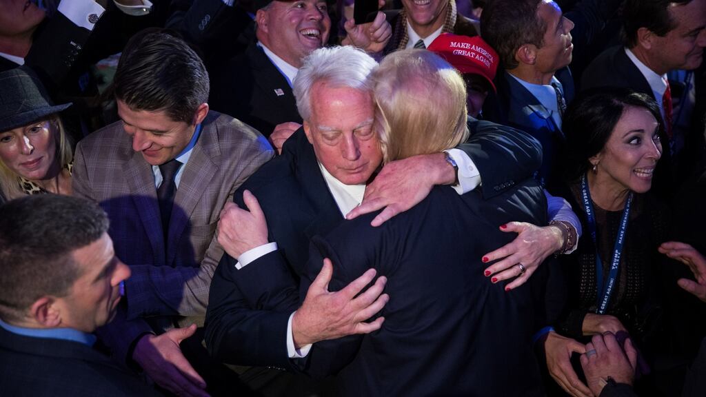 Donald Trump embraces his brother Robert at an election night event in Manhattan, November 8th, 2016. Photograph: Damon Winter/The New York Times