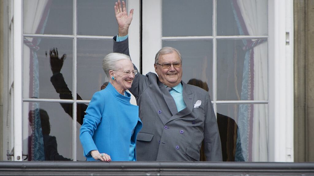 Denmark’s Queen Margrethe II and Prince Henrik wave from a balcony at Amalienborg Palace in Copenhagen. File photograph: Marie Hald/Scanpix/Reuters