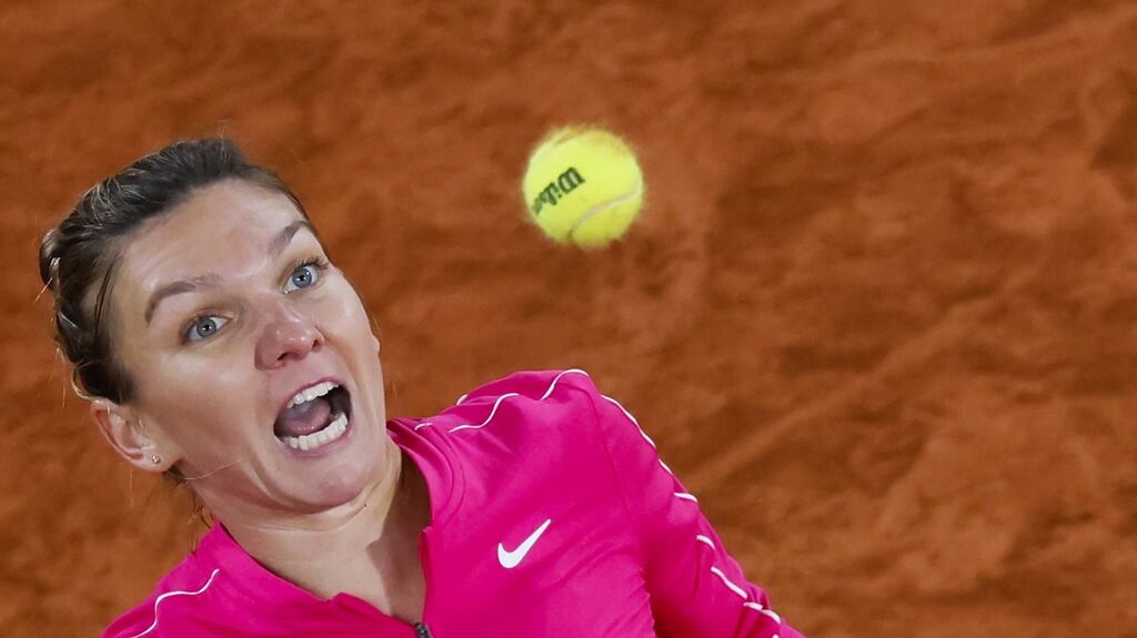 Romania’s Simona Halepfocuses on the  ball as she returns it to Amanda Anisimova during the third-round match at the French Open. Photograph: Thomas Samson/AFP via Getty Images