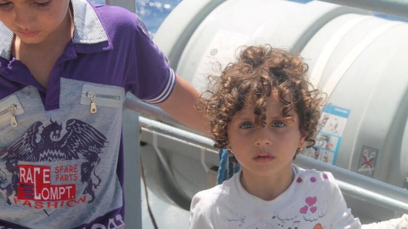 Two of the more than 70 migrant children rescued from a barge off the coast of Libya on Wednesday by the ‘LE Niamh’. Photograph: Defence Forces