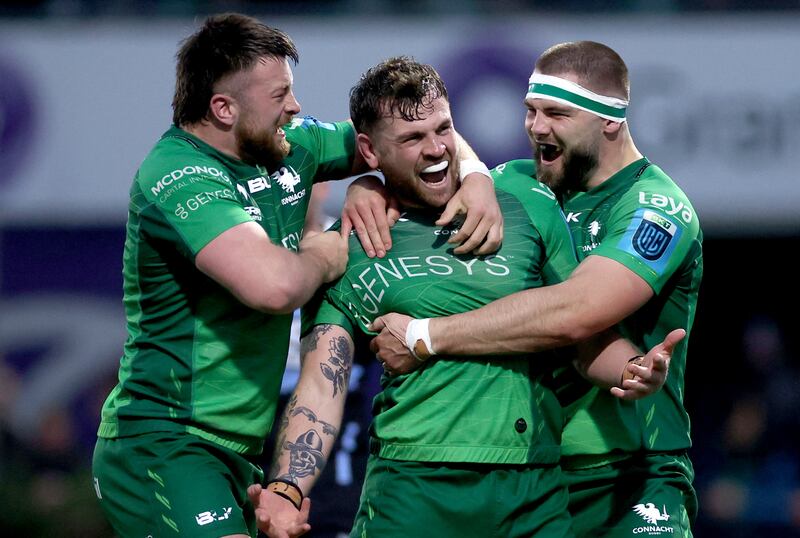 Connacht’s Dylan Tierney-Martin and Shamus Hurley-Langton celebrate with try scorer Conor Oliver during the recent victory over Cardiff Rugby at the Sportsground. Photograph: James Crombie/Inpho